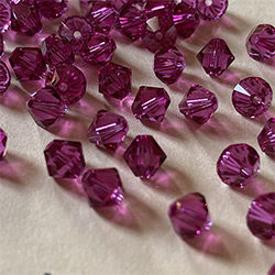 Buy a 3mm Fuchsia Bicone from Beads’ of’ Nefertari at House of Greco