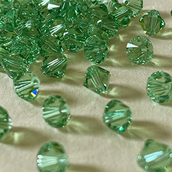 Buy a 6mm Peridot Bicone from Beads’ of’ Nefertari at House of Greco