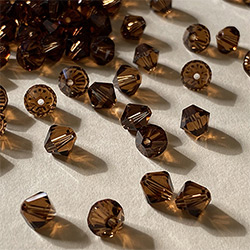 Buy a 3mm Smoked Topaz Bicone from Beads’ of’ Nefertari at House of Greco