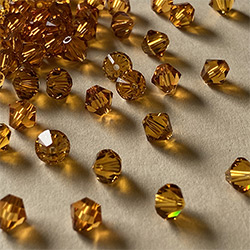 Buy a 3mm Topaz Bicone from Beads’ of’ Nefertari at House of Greco