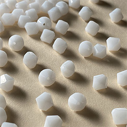 Buy a 3mm White Alabaster Bicone from Beads’ of’ Nefertari at House of Greco