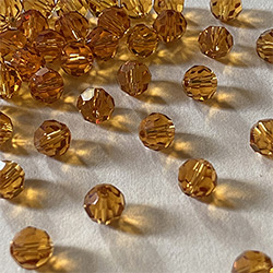 Buy a Topaz ~ 6mm Round from Beads’ of’ Nefertari at House of Greco